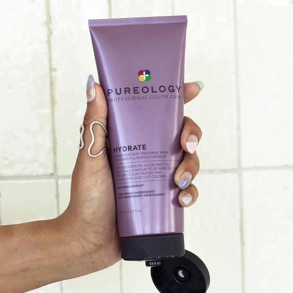 Hand holding Pureology Hydrate